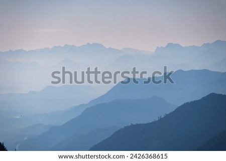 Panoramic view of magical mountain peaks of Karawanks and Julian Alps seen from Goldeck, Latschur group, Gailtal Alps, Carinthia, Austria, EU. Mystical atmosphere in Austrian Alps on sunny summer day. Royalty-Free Stock Photo #2426368615