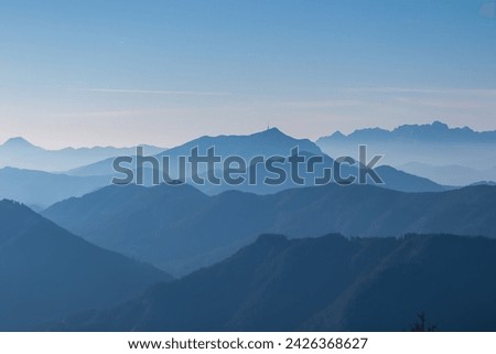 Panoramic view of magical mountain peaks of Karawanks and Julian Alps seen from Goldeck, Latschur group, Gailtal Alps, Carinthia, Austria, EU. Mystical atmosphere in Austrian Alps on sunny summer day. Royalty-Free Stock Photo #2426368627