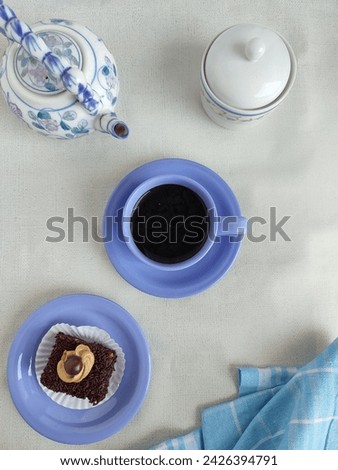 A cup of coffee and a piece of cake... flat lay photography 