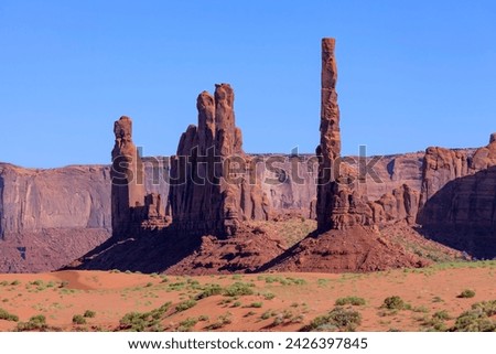 Totem Pole and Yei Bi Chei in Monument Valley, Monument Valley Navajo Tribal Park : AZ, USA Royalty-Free Stock Photo #2426397845