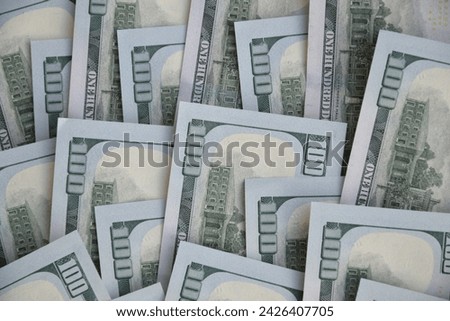 Processed collage of many US hundred dollar bills banknotes texture. Background for banner, backdrop or texture for 3D mapping