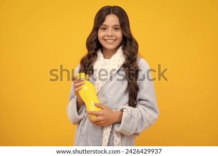 Girl holds water bottle. Kid girl care body hydration. Active leisure and water balance. Active and healthy kid drink water. Staying hydrated.