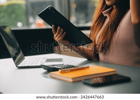 Woman is working in the office. Concept of small business.
