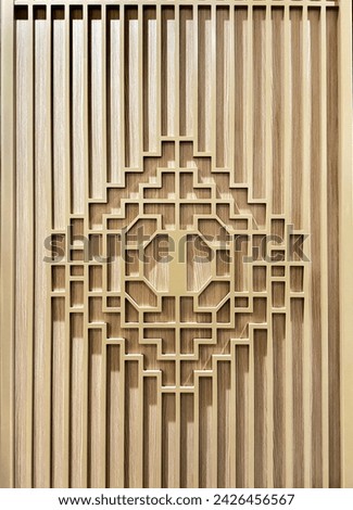 Chinese longevity engraving and ornament decoration with fluted panel in light oak wooden finishes. Royalty-Free Stock Photo #2426456567