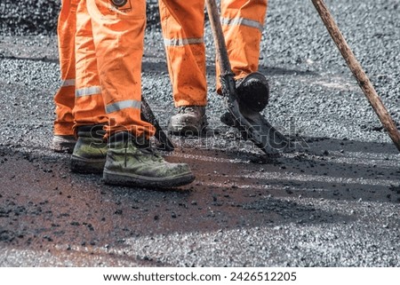 Rehabilitation of the road with asphalt Royalty-Free Stock Photo #2426512205