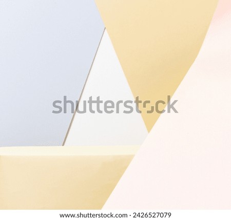 Abstract background with lines forming triangles such as shapes and empty spaces for creative design markers, intersections of spot pattern beige and yellow, light blue paper background. Royalty-Free Stock Photo #2426527079