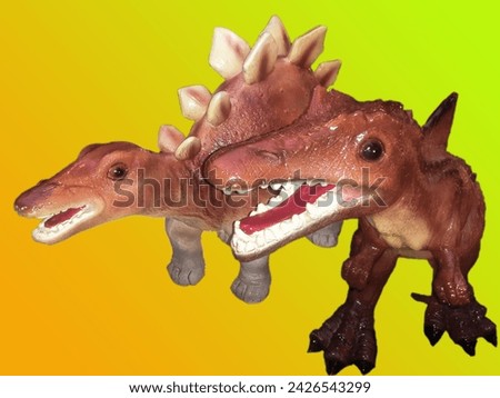 Dinosaur looks angry and smiling. They are 2 friends. stays together and always happy. they keep teeth clean and shiny. their skin is ruff and tuff. they keep themselves active and healthy. be happy. 