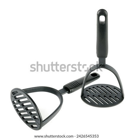 Kitchen utensils, potato masher isolated on white background. Collage. There is free space for text. Royalty-Free Stock Photo #2426545353
