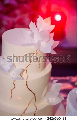 It is a decorated dessert item commonly used for events like birthdays or weddings.
