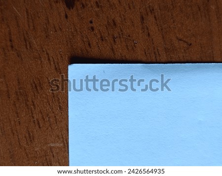 white paper on a brown table