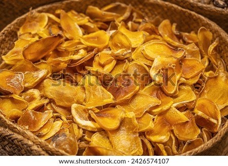 Sun-Dried Persimmon Slices in Rustic Basket
