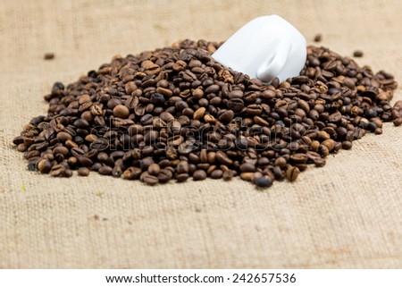 Coffee beans on brown jute background