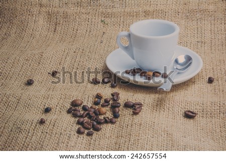 Coffee beans on brown jute background