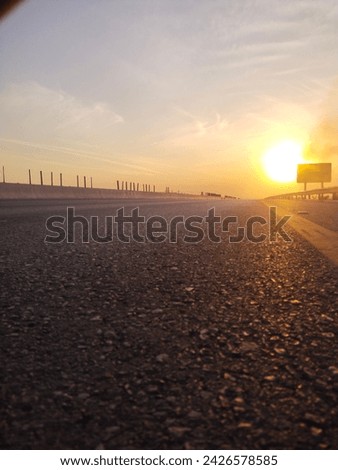 "Twilight Journey: Sunset on the Motorway"