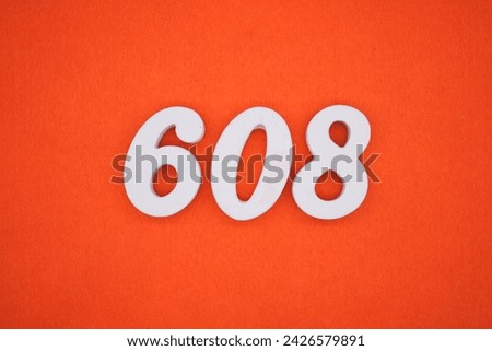 Orange felt is the background. The numbers 608 are made from white painted wood.