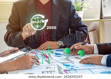 Net zero and carbon neutral concept. Net zero greenhouse gas emissions target. Climate neutral long term strategy. Businessman touching on net zero icon with decarbonization icon on smart background.