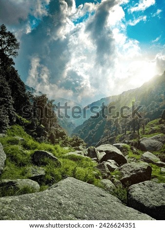 green and gray mountains under white clouds and blue sky during daytime