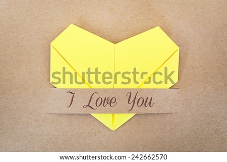 Valentines card, The yellow heart shape paper on brown with "I love you" label