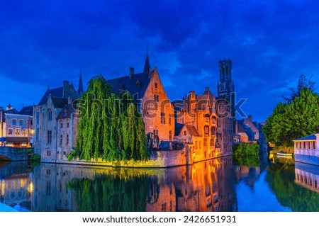 Bruges cityscape, Brugge old town scenic view, Bruges historical city centre, Rosary Quay Rozenhoedkaai embankment, Belfort Belfry tower, Dijver water canal, evening view, West Flanders, Belgium Royalty-Free Stock Photo #2426651931