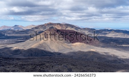 The lunar landascape of lava with the vulcanos in Lanzarote, canaries, view of the Timanfaya national park