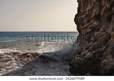 Large waves breaking over rocks