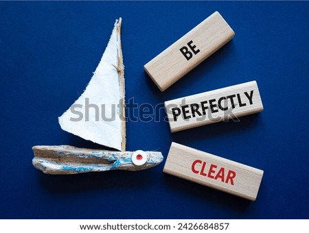 Be perfectly clear symbol. Concept words Be perfectly clear on wooden blocks. Beautiful deep blue background with boat. Business and Be perfectly clear concept. Copy space Royalty-Free Stock Photo #2426684857