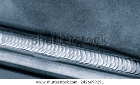 welding seam onto steel sheet angle metal Royalty-Free Stock Photo #2426699291