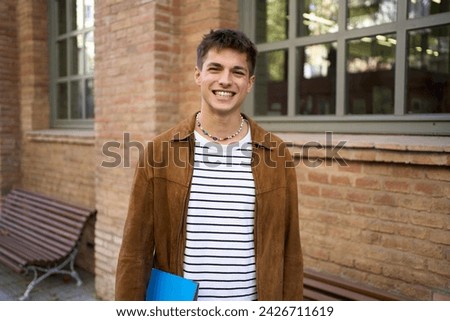 Close up portrait of happy young European student happy smiling face on University campus. Male person with cheerful expression looking at camera outdoors. Nice boy posing for photo collage