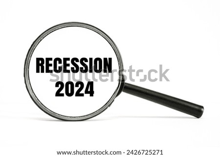 A magnifying glass with word “RECESSION 2024” on it. Business and finance concept