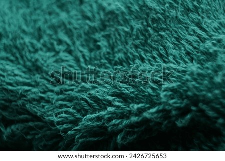 green stringy fabric, which has elegant waves