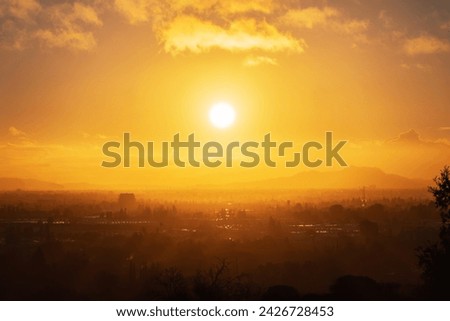 Los Angeles morning sun bursting through layers of fog above the San Fernando Valley.  