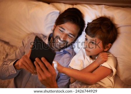 Bedroom, father and son with tablet, night and family with ebook and connection with social media. Dad, house and boy with technology and bedtime story with lights and bonding together with hobby