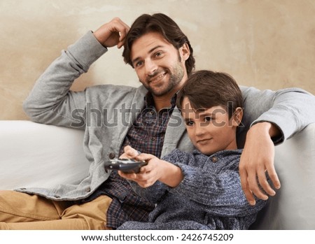 Happy, TV and father and child on sofa with remote for bonding, relationship and relax in living room. Family, parents and dad with young son for cartoon, watching movies and entertainment in home