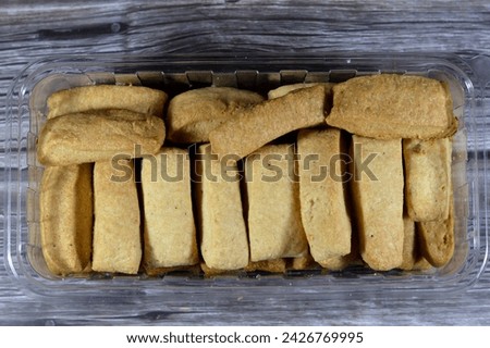 Plain Menen bakery, oriental crackers and cookies, usually baked plain or stuffed with tamr, Ajwa or dates, Arabic Egyptian oriental cuisine of cookies, consumed as a snack with a drink like tea Royalty-Free Stock Photo #2426769995