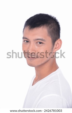 portrait of young man in white t-shirt standing isolated on white background