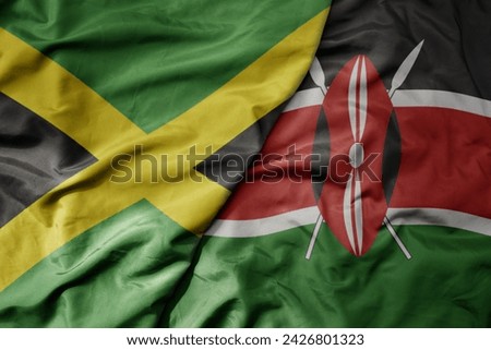 big waving national colorful flag of kenya and national flag of jamaica . macro