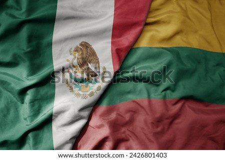 big waving national colorful flag of lithuania and national flag of mexico . macro