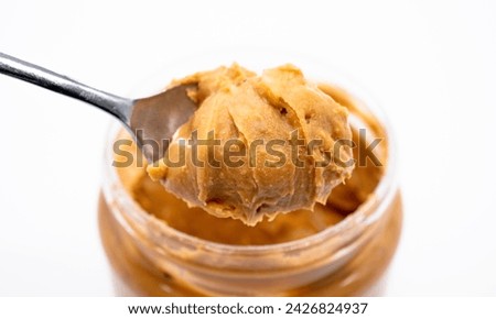 National Peanut Butter Valentine's Day. Peanut butter in a bowl on the table, important date March 1. Peanut butter with bread. Peanut butter with apples, breakfast