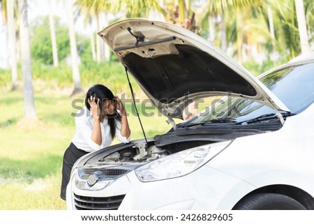 woman driver using mobile phone during problem car. Breakdown or broken car on road. Vehicle Insurance, maintenance and service and assistance service concept.
