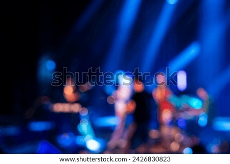 Blurred picture of band playing on stage, concert background