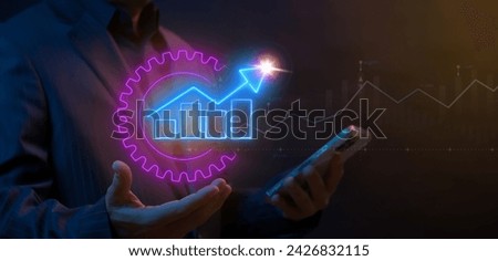 Businessman showing neon cogwheel with up arrow graph and chart animation. Money, profit, investment, growth business, economy, finance and success concept.