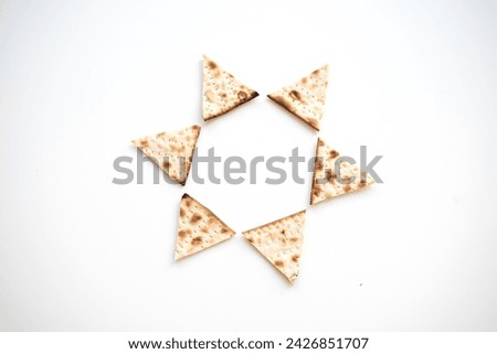 passover. White banner with Traditional Matzo shape of six traingle by star Magen David prepared for Passover Holiday of Jewish people. top view. Spring Holiday. Fasting time