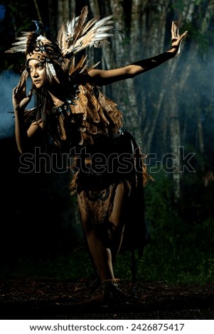 Dara,model from tanjung,south kalimantan.wearing a traditional clothes from dayak tribe in south kalimantan.the clothes made from tree. Royalty-Free Stock Photo #2426875417
