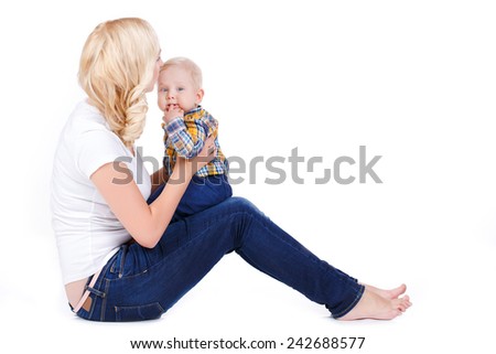 picture of happy mother with baby over white. Mother holding sweet baby boy. mother kissing her baby