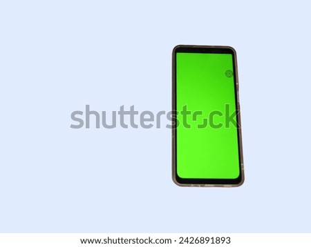 photo from the top of the cellphone with a green screen showing the cellphone assistant on the screen on the top right