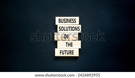 Business solutions of the future symbol. Concept words Business solutions of the future on wooden blocks. Beautiful black table black background. Business solutions of the future concept. Copy space.