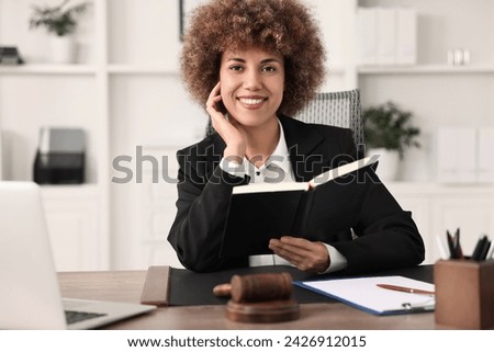 Notary with notebook at workplace in office