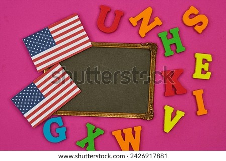 usa flag card with frame photo and alphabets on pink background. Concept of English language courses