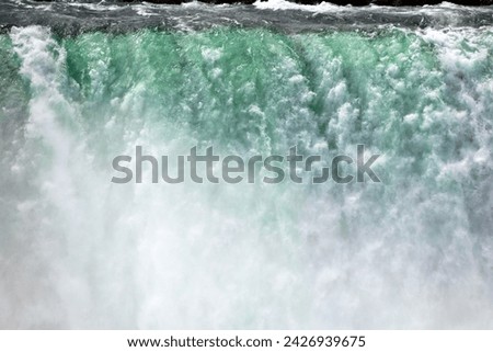 one of the largest waterfalls in the world with a greenish tint to the water