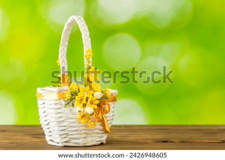 Easter white basket on a background of beautifully blurred greenery, Concept, spring season, happy Easter, copy space
